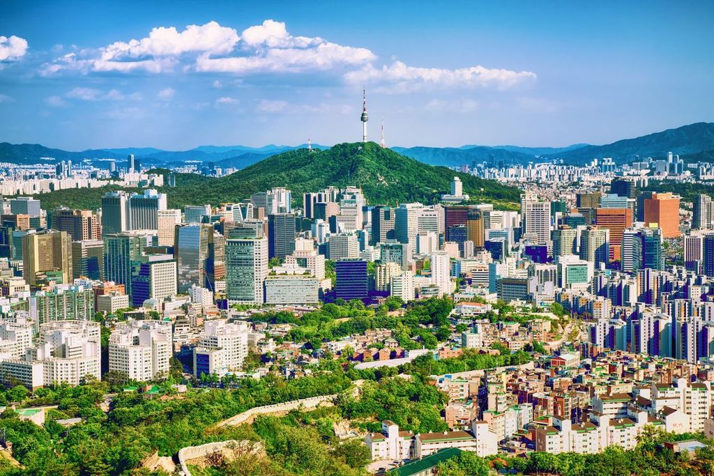 Seoul downtown cityscape with fortress and Namsan Seoul Tower on sunset Seoul, South Korea