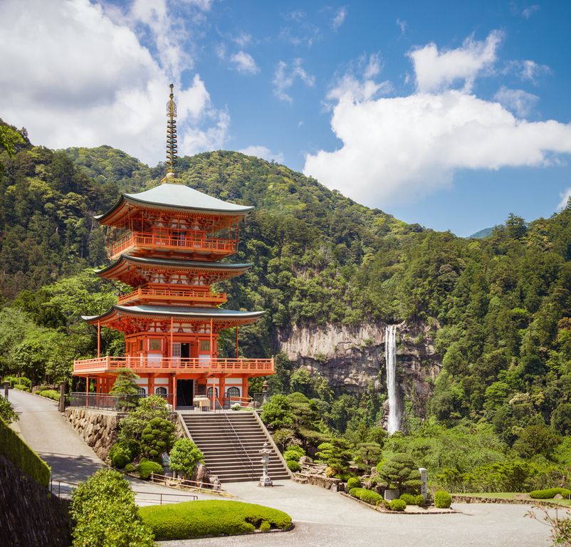 Sanjūdō Pagoda, located in Wakayama Prefecture to the East of the Kumano Kodo pilgrimage route, with the Nachi Falls in the background