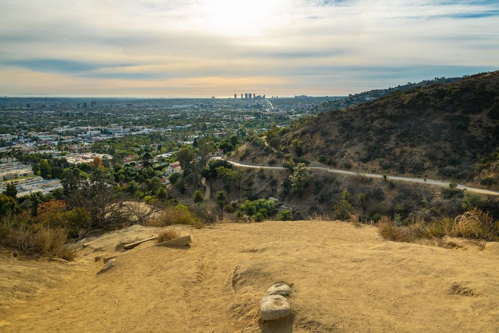 Sunset in Runyon Canyon Park with view of downtown Los Angeles in the distance