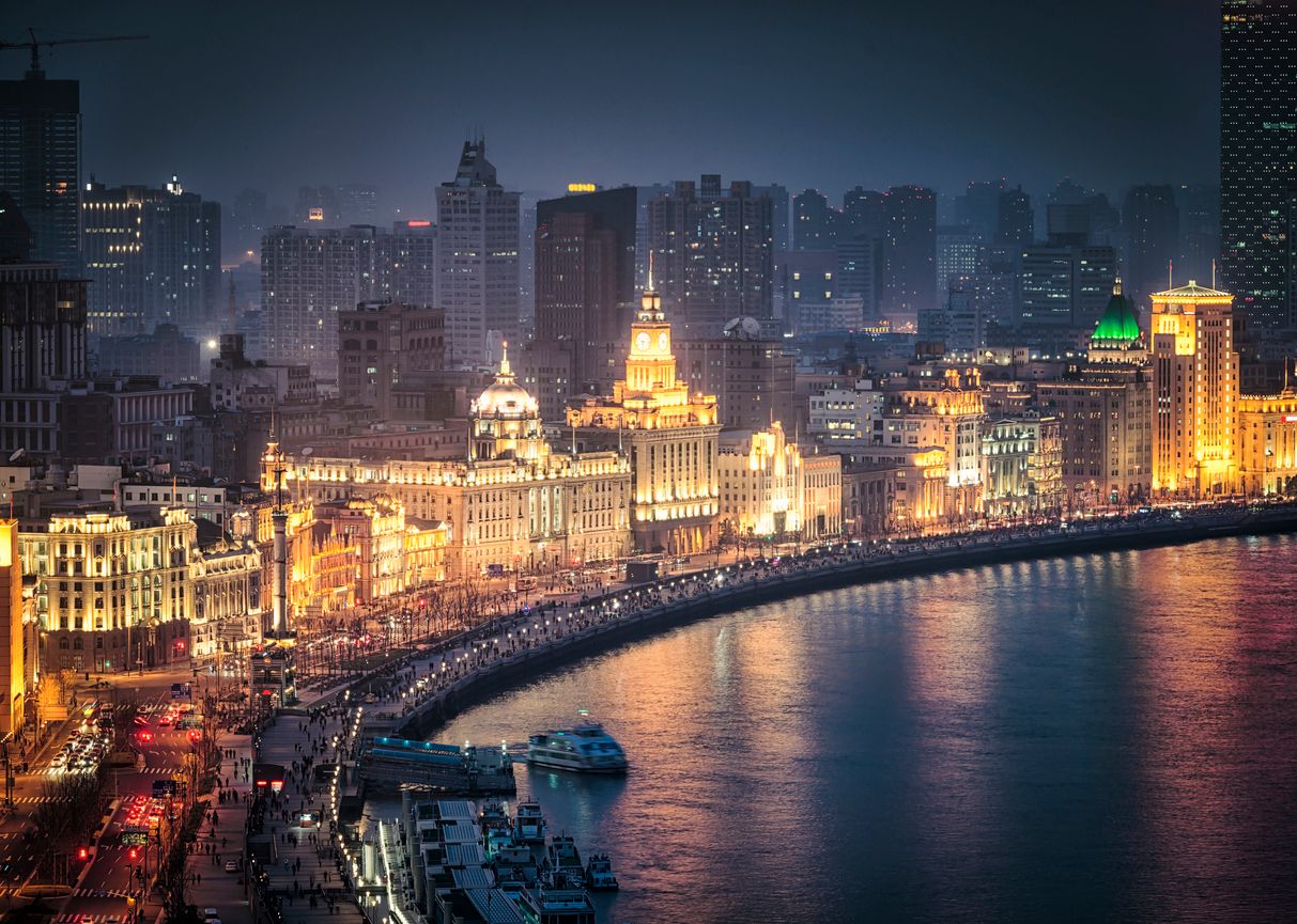 High angle night view looking onto the famous, historic architecture of The Bund (Zhongshan Road), facing the Huangpu river in Shanghai, China.