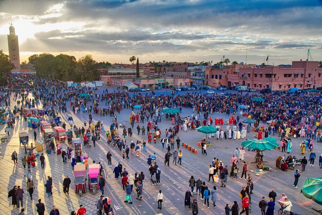 People visit Jemaa el-Fnaa square market of Marrakesh city, Morocco