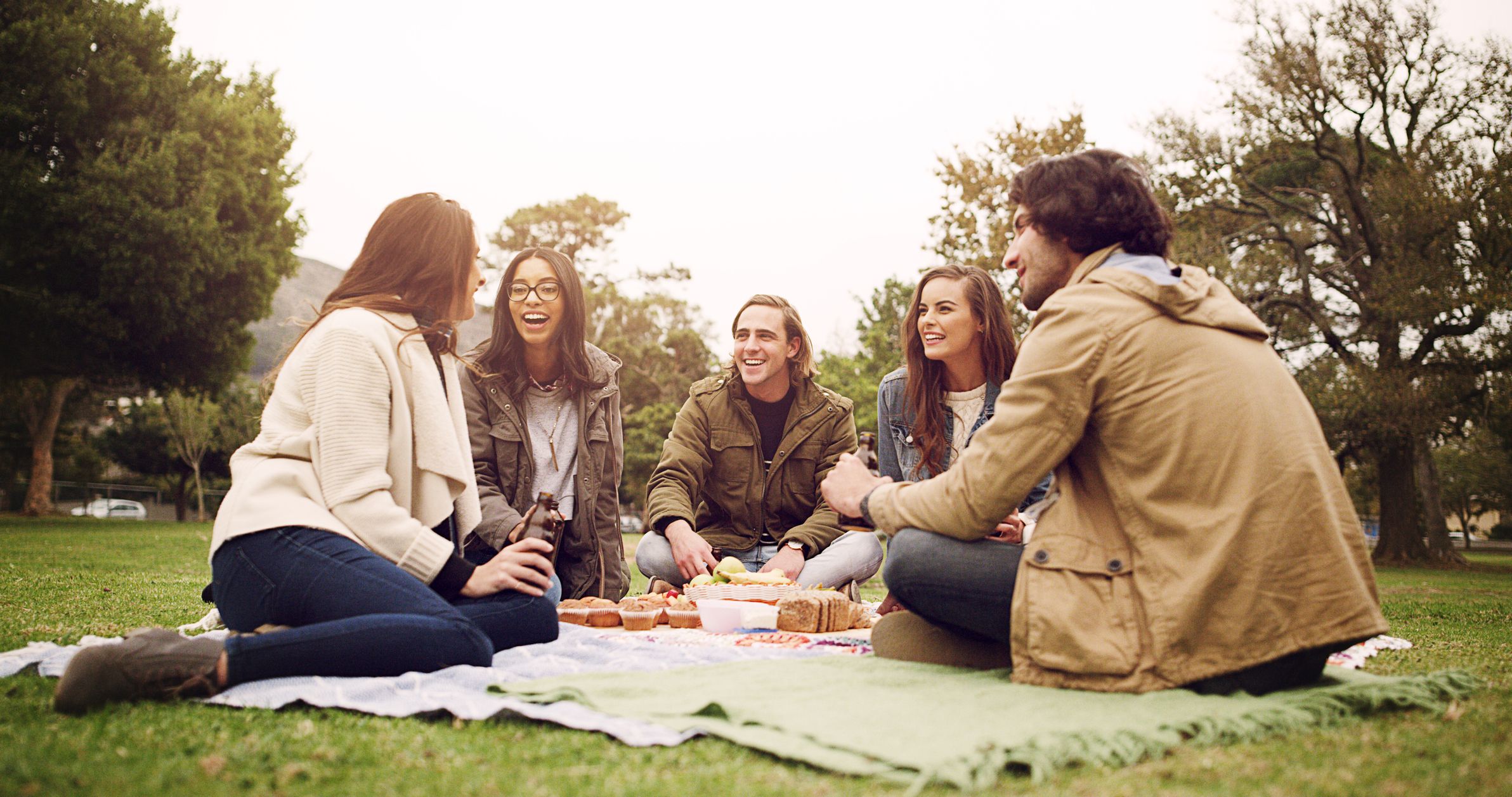 Young friends having a picnic outside