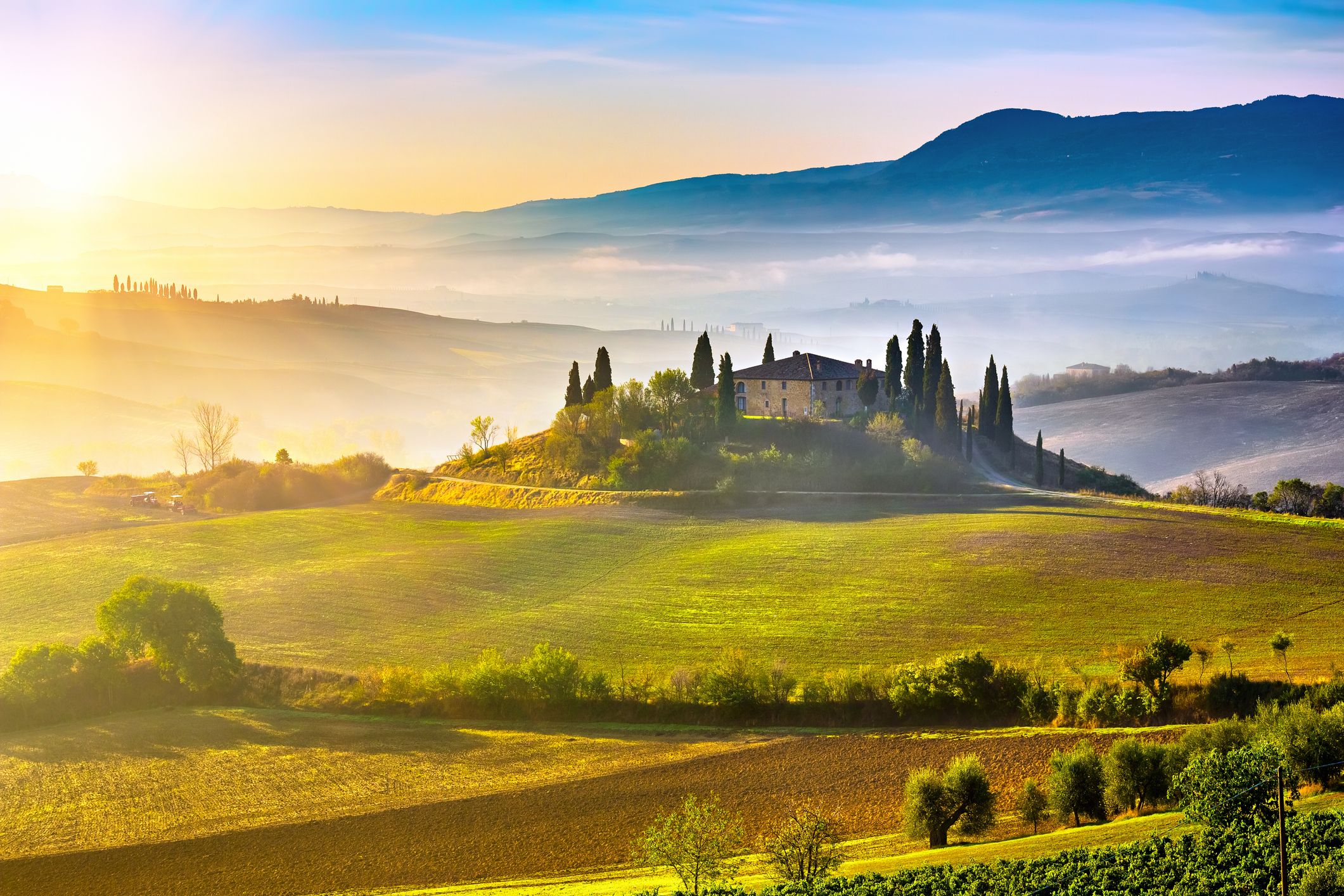 Tuscany foggy landscape at sunrise, Italy