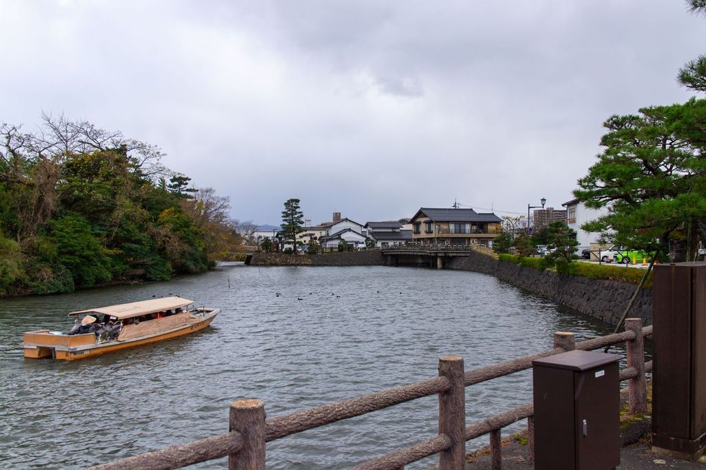 A sightseeing boat going down the Horikawa river near Matsue Castle
