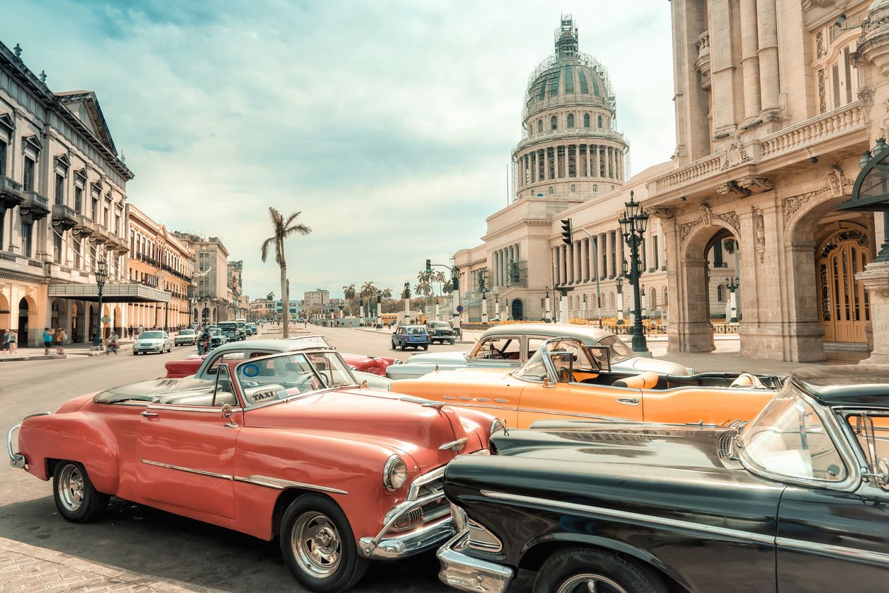 Oldtimer taxi cars parking in front of Capitol in Havana, Cuba