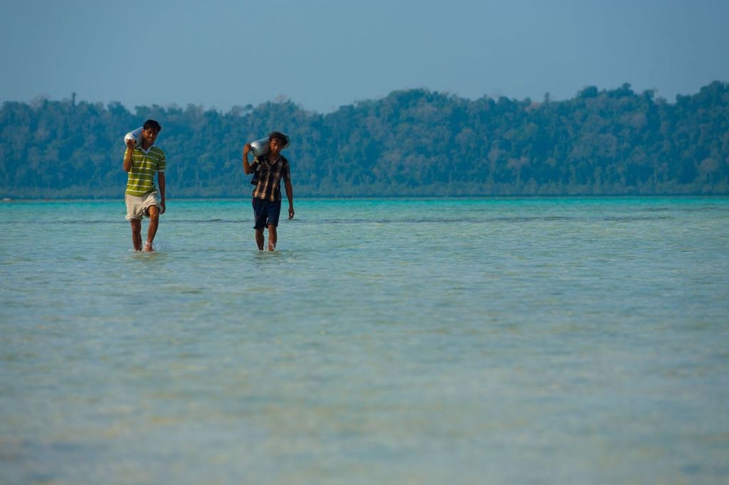Workers Carry Diving Oxygen Tank for Havelock Island tourism.
