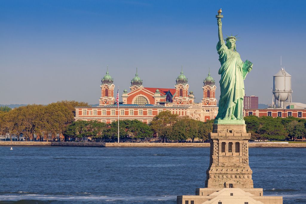 Statue of Liberty, Ellis Island and Water of New York Harbor, NY, USA