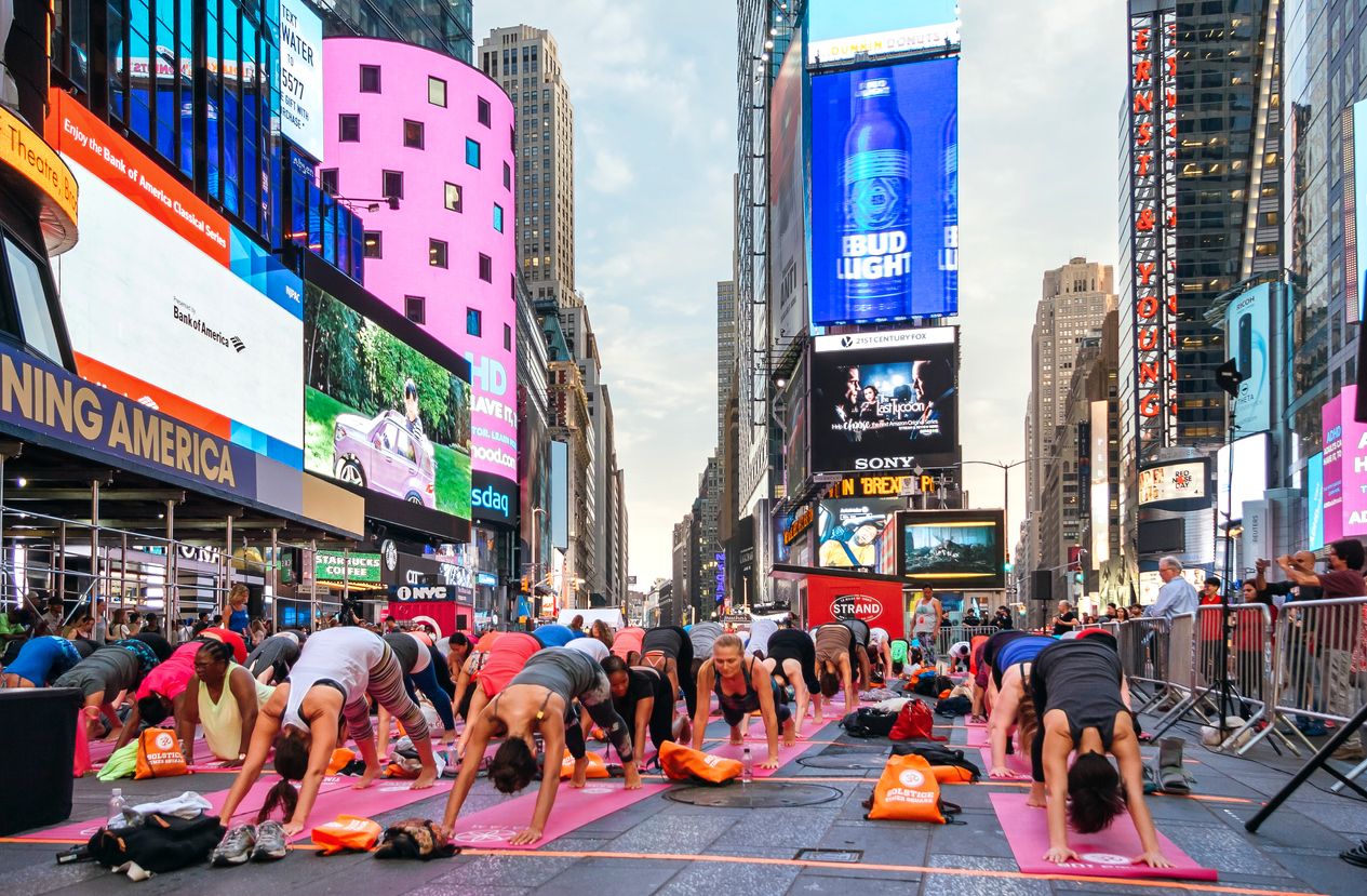 People in the yoga annual concentration in Times Square, New York City, USA.