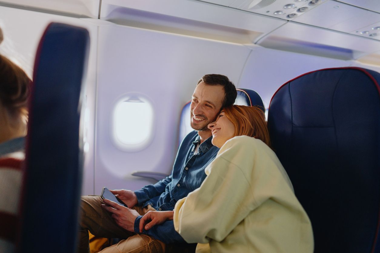 Couple traveling by plane.