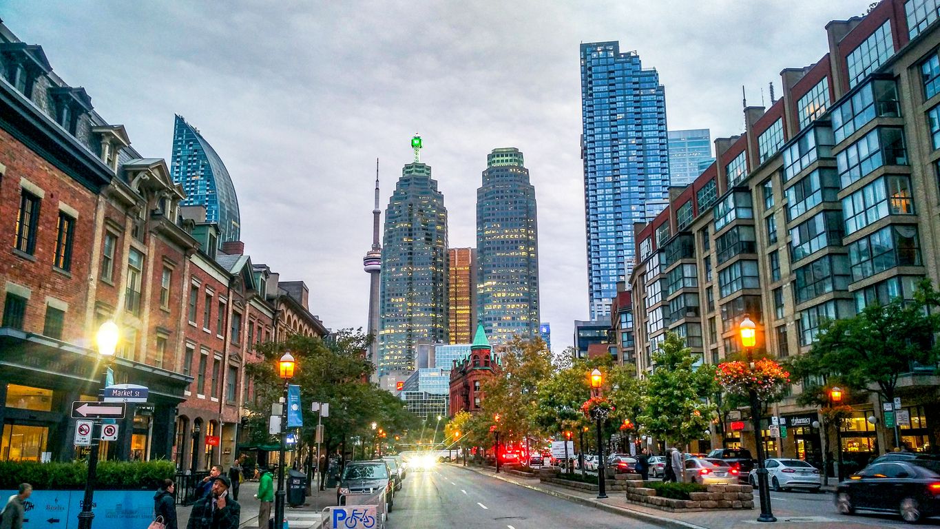 Colorful Street View from St. Lawrence Market, CN Tower, Modern Buildings Included, Lights On, Dawn Comes, Before Night