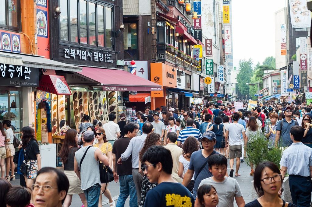 Tourists and shoppers line the sidestreets of Insadong in Seoul, South Korea