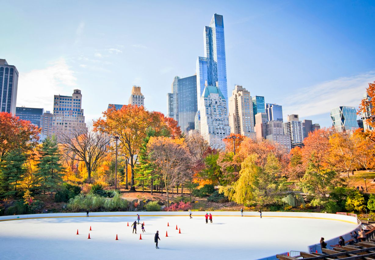 People skating in Central Park in fall, New York City, USA.