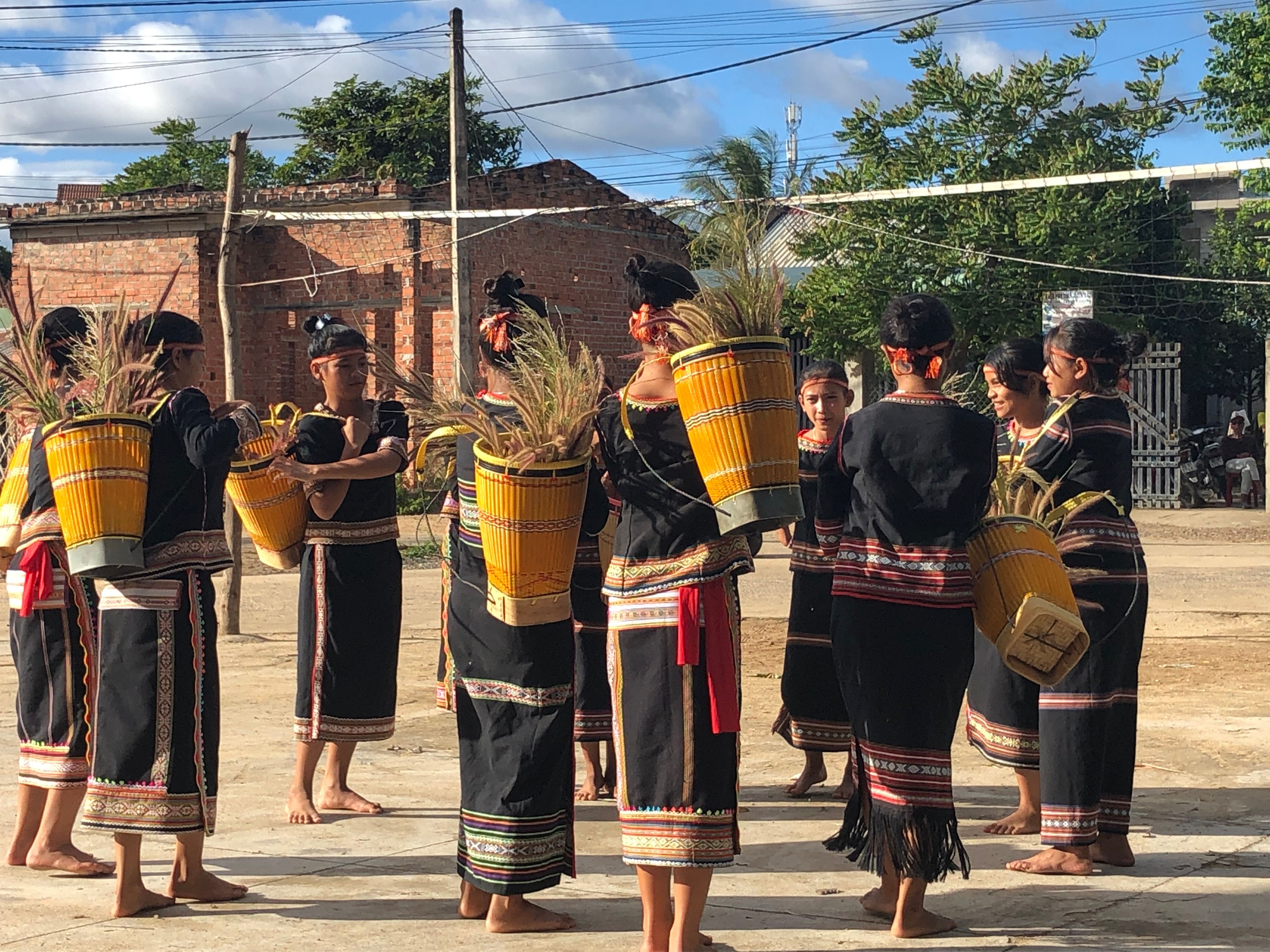 Bahnar girls doing a traditional dance at a festival in a Bahnar village (also known as Ba Na people), Kon Tum, Vietnam