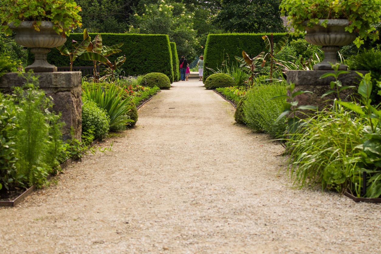 Two women and a young girl walking throughout Boerner Botanical garden.