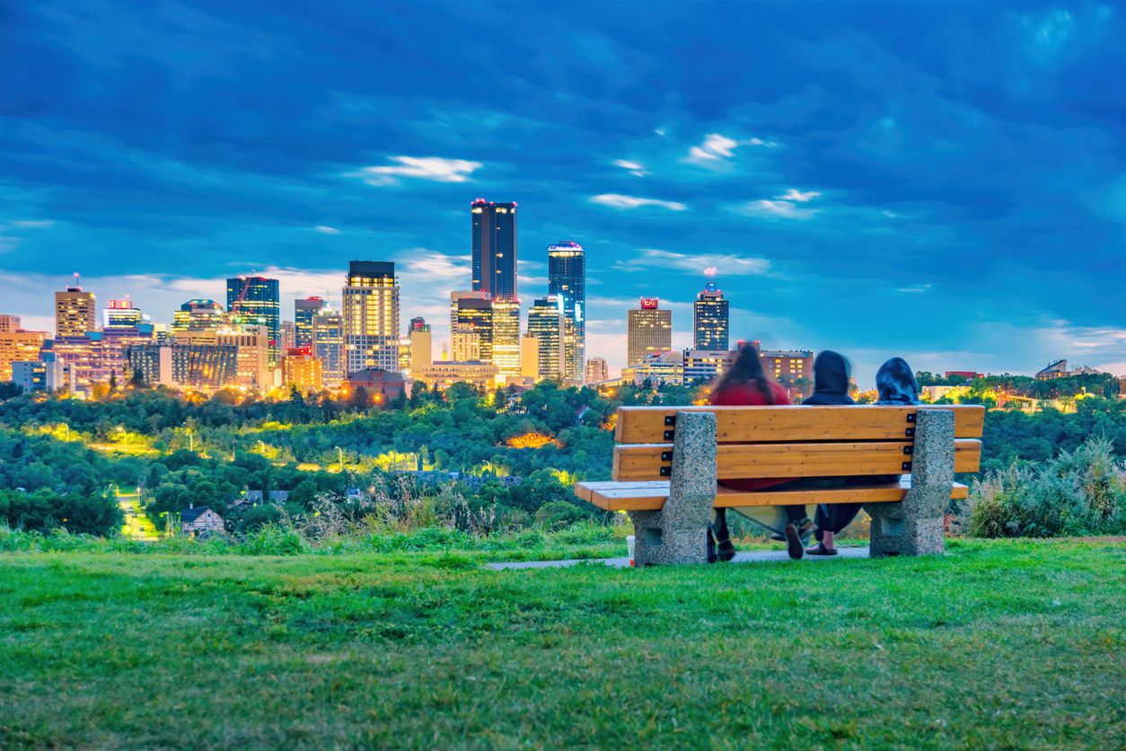 Edmonton Skyline Alberta Canada People relax on bench