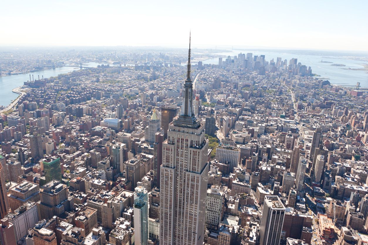 Aerial view of Manhattan with the Empire State Building in the fore front.