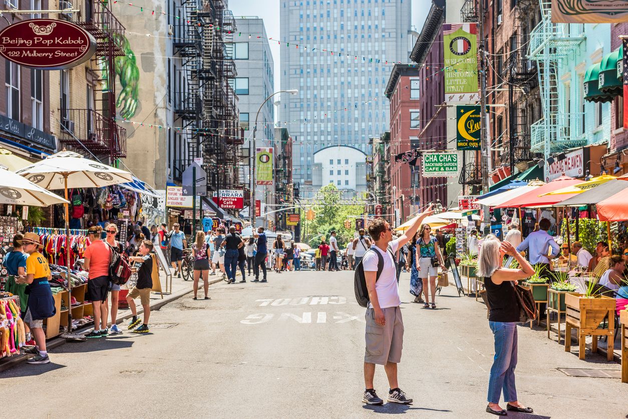 Busy street with pedestrians in Little Italy, NYC