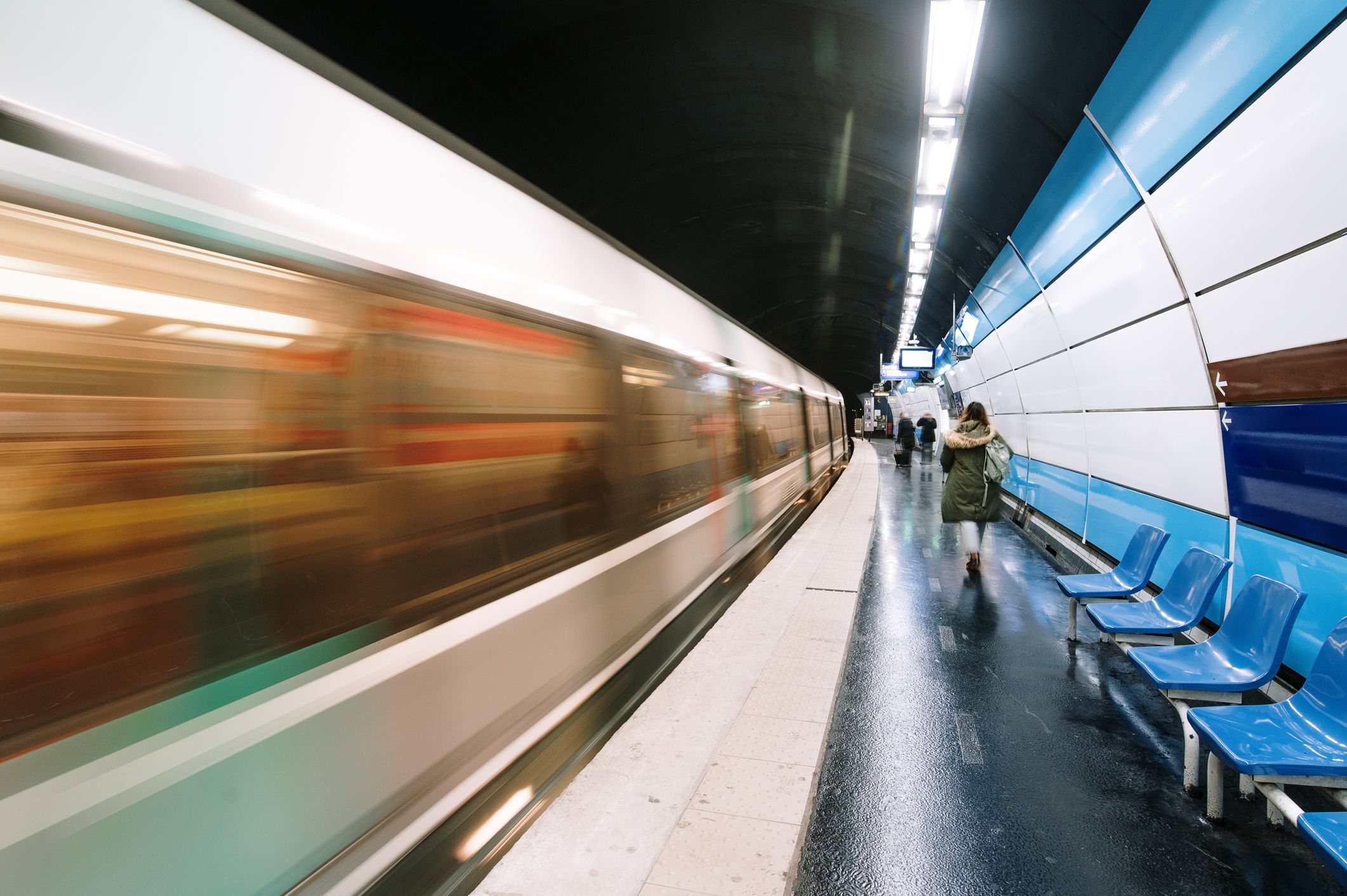 Subway train in motion in a station