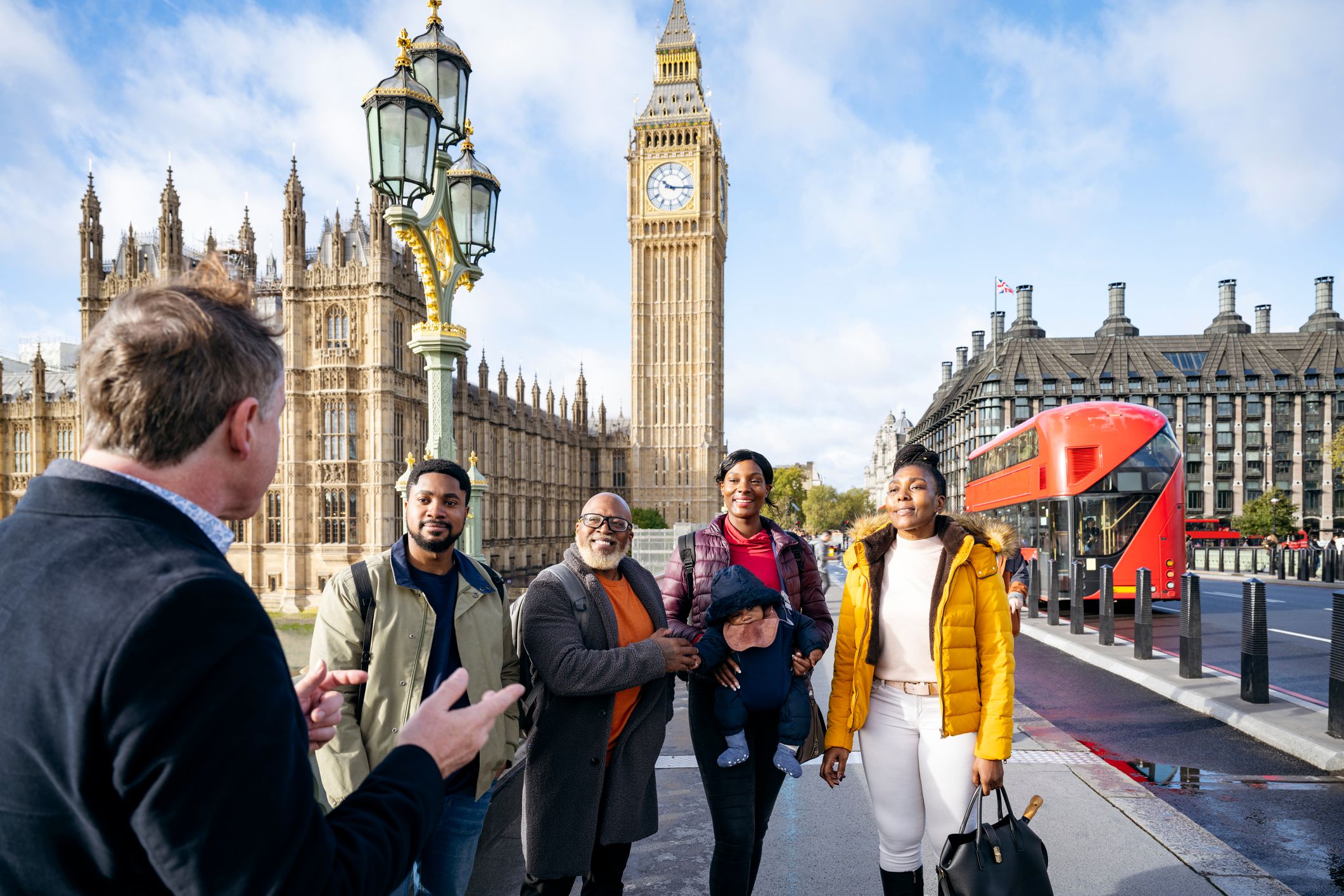 Vacationing family enjoying guided tour of London