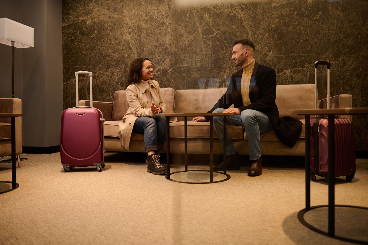 Business partners, businessman and businesswoman negotiating in a private meeting room in the airport