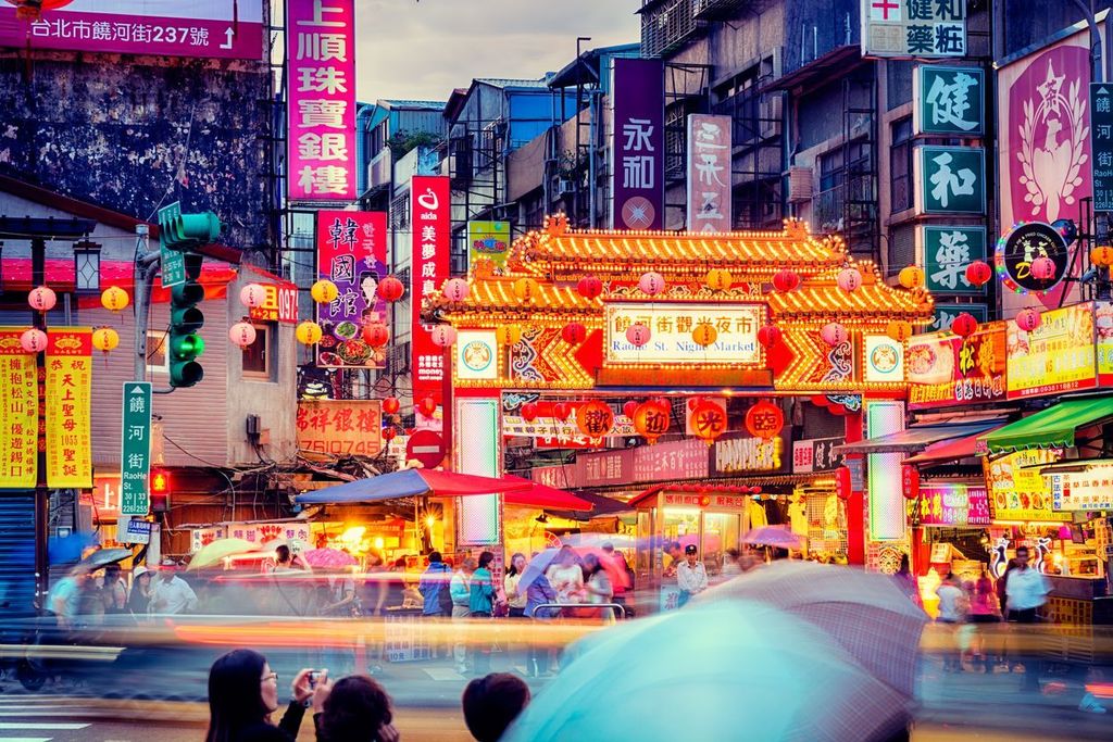 Raohe Street Night Market in Taipei, Taiwan with lots of traditional Chinese characters on signs