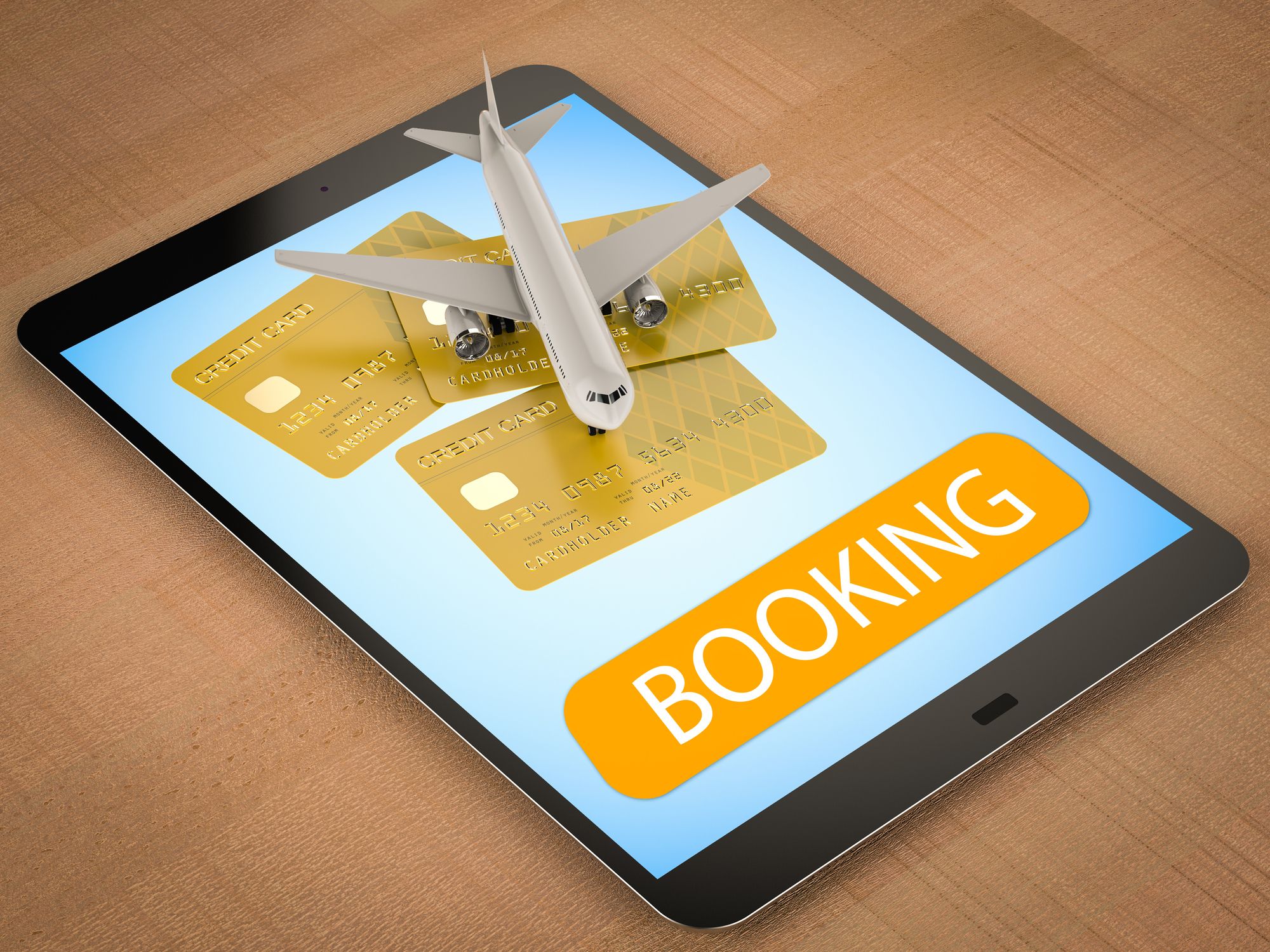Online booking concept with an airplane and credit cards on a tablet