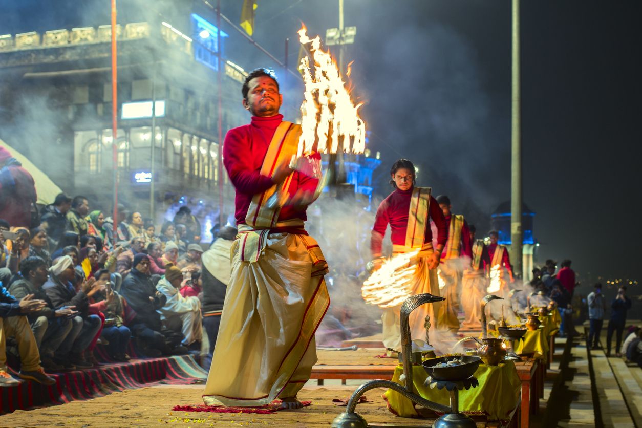 Varanasi Ganga aarti rituals at Assi ghat performed by young priests before sunrise at the Ganges river ghat at Varanasi India.