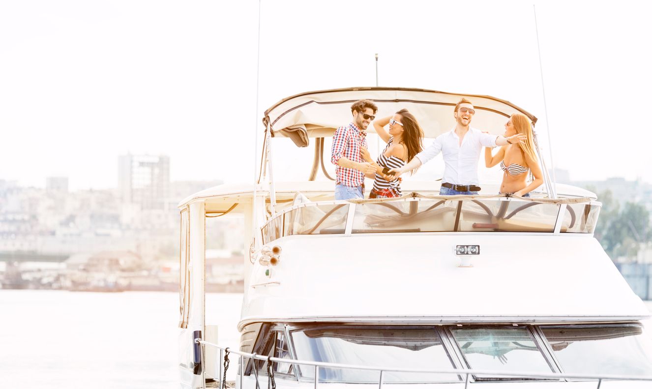 Young People Drive Yacht and having fun