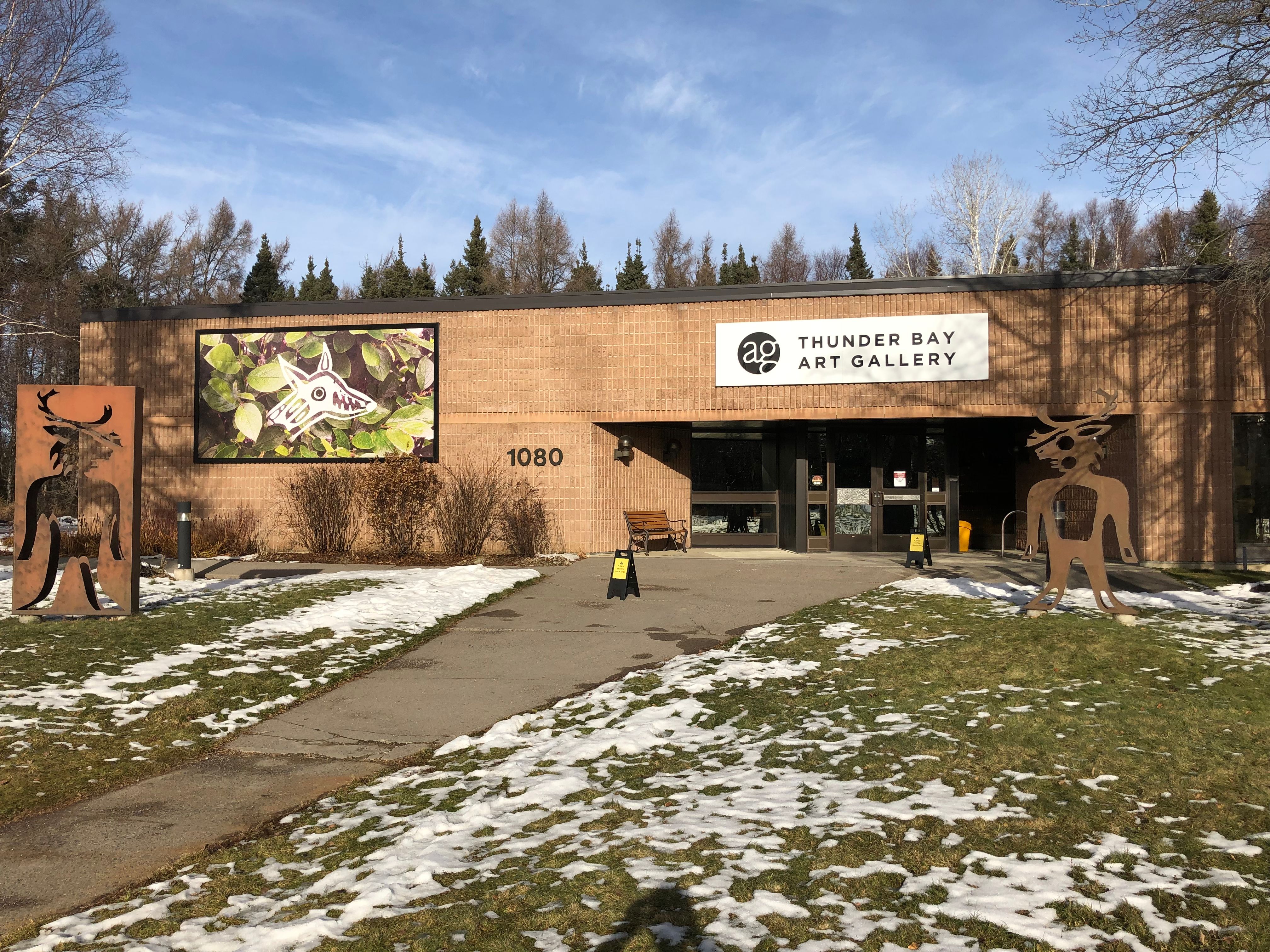 Thunder Bay Art Gallery view from the front in autumn, some snow on the ground.