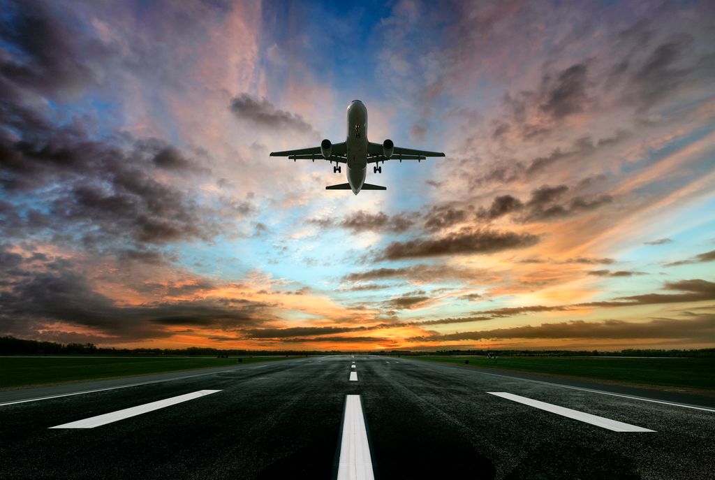 Passenger airplane taking of at sunrise