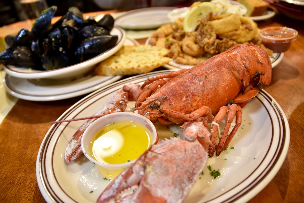Boston Lobster and other seafood plates from the Union Oyster House, Boston, USA.