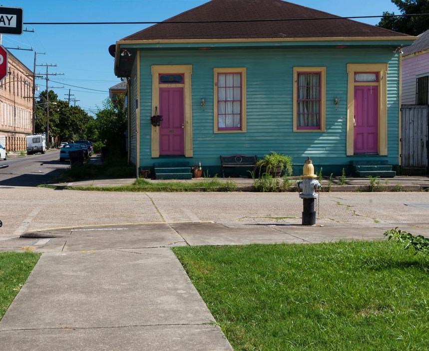 View of a street with colorful houses in the Marigny neighborhood in the city of New Orleans, Louisiana