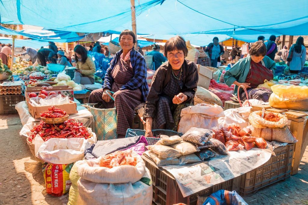 People shopping for produce at the Paro weekend market in Bhutan
