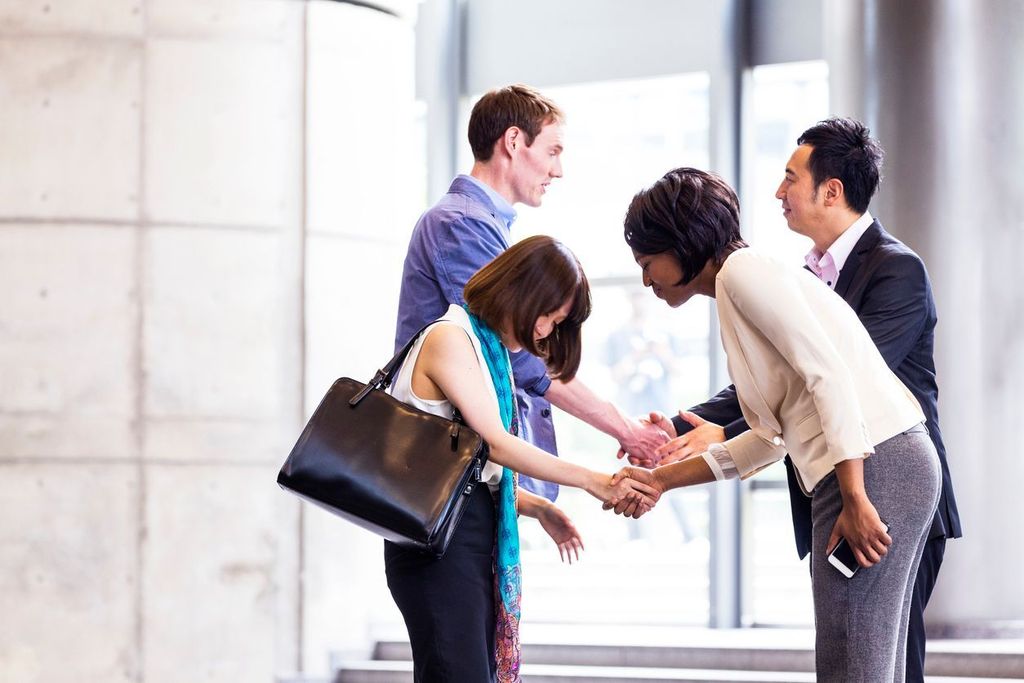 Business Executives Greeting with Respect