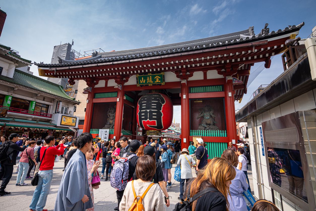 Tourists visit The Kaminarimon gate, near Senso-Ji Temple in Asakusa, Tokyo, Japan