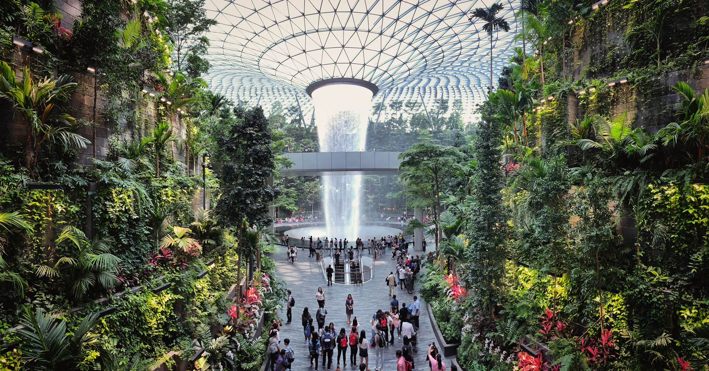 Visitors tour around the Rain Vortex inside the Jewel area at Changi Airport.