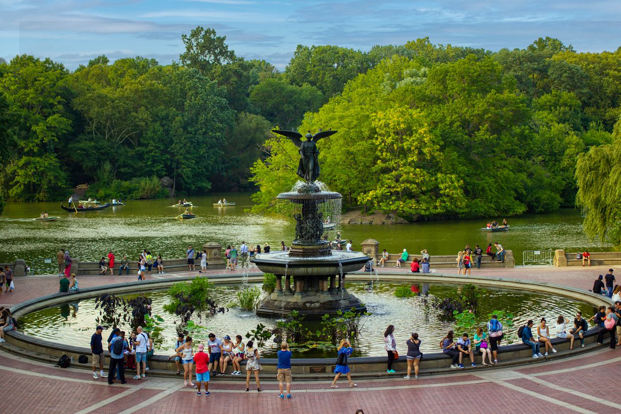People walking around the historic Bethesda Fountain in Central Park