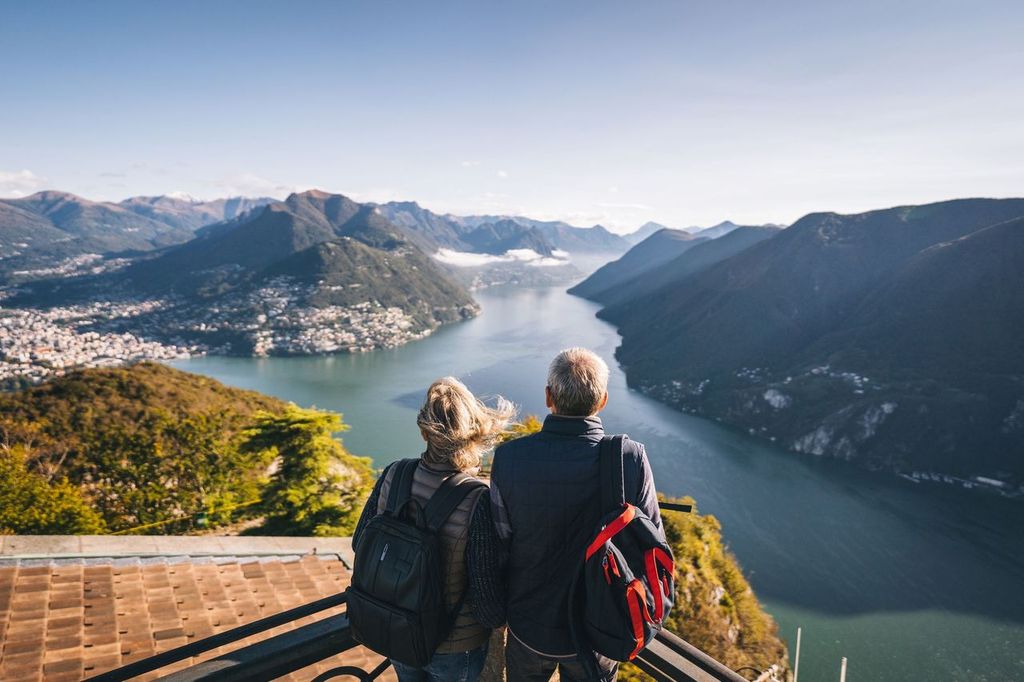 Mature couple hike above lake Lugano