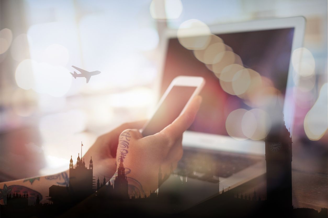 Booking travel on phone or laptop