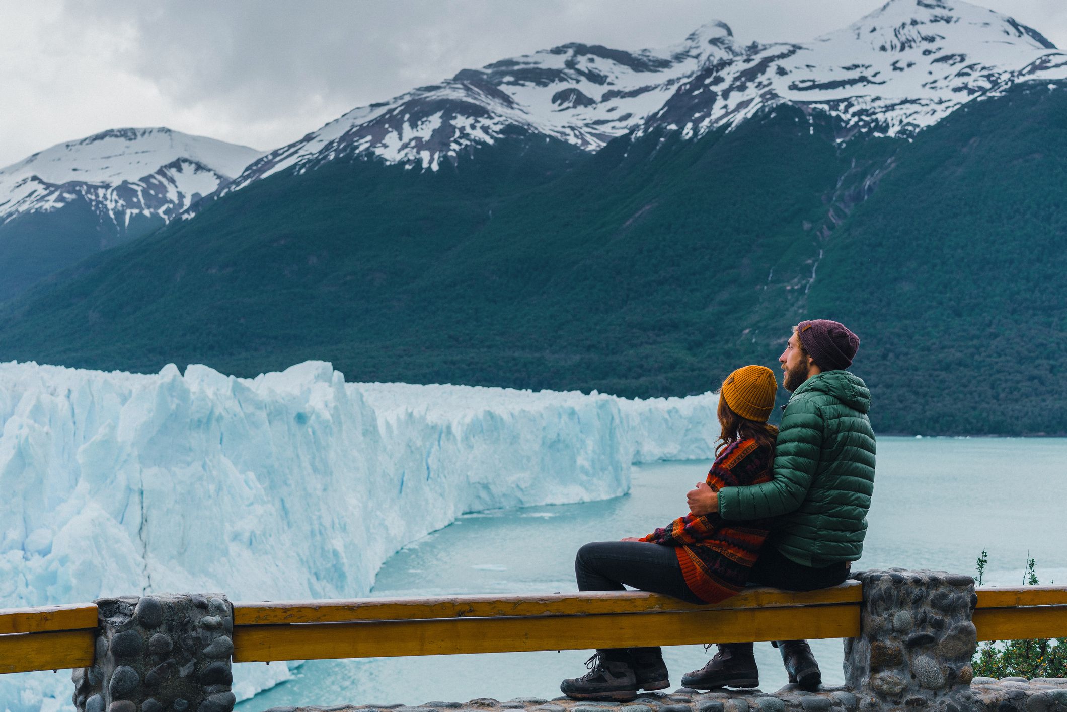 Couple looking at scenic view of Perito Moreno Glacier in Patagonia