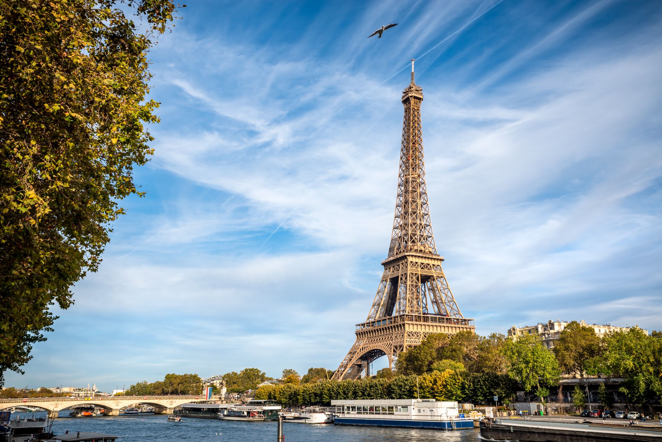 The Eiffel tower from the river Seine in Paris, France - easily affordable for $15,000 vacation ideas.