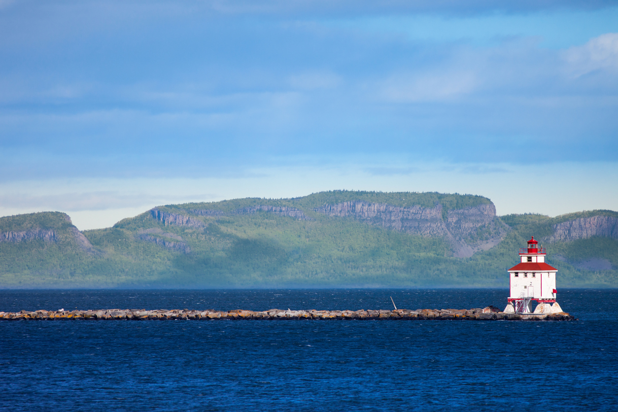 Thunder Bay lighthouse with the Sleeping Giant rock formation in the background, Ontario, Canada