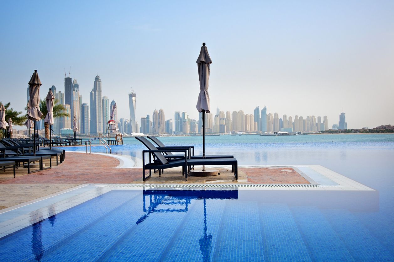 Holiday resort by the pool on the Palm Island in Dubai with a view of Jumeirah.
