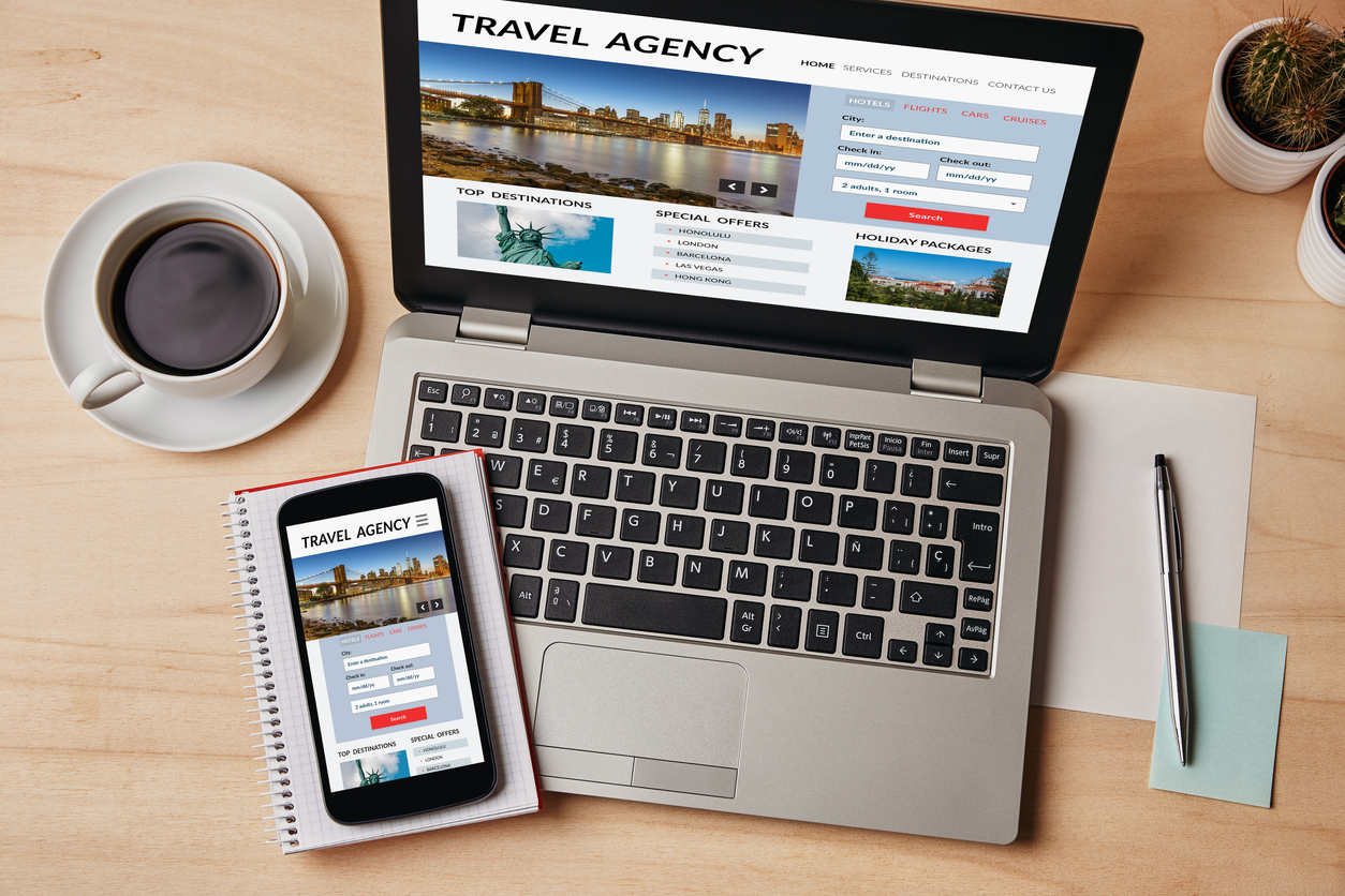Travel agency concept on laptop and smartphone screen