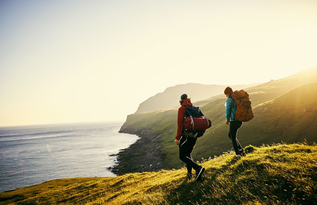 Couple hiking through the mountains.