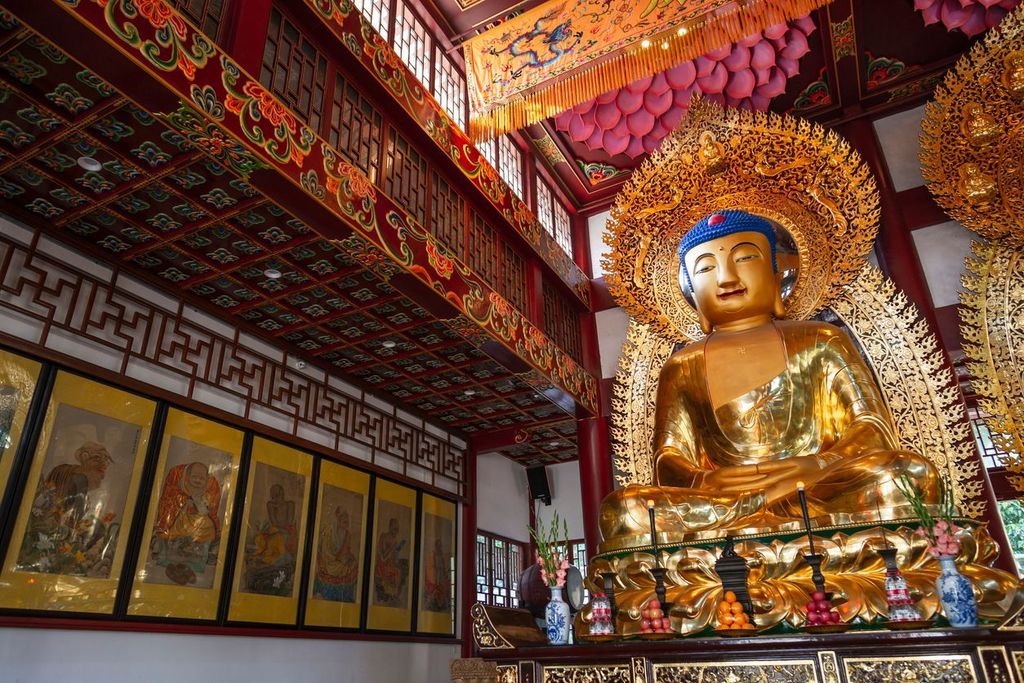 Statues of ancient chinese artistic golden buddhas, in temple of the six banyan trees (Liurong Temple), Guangzhou, China
