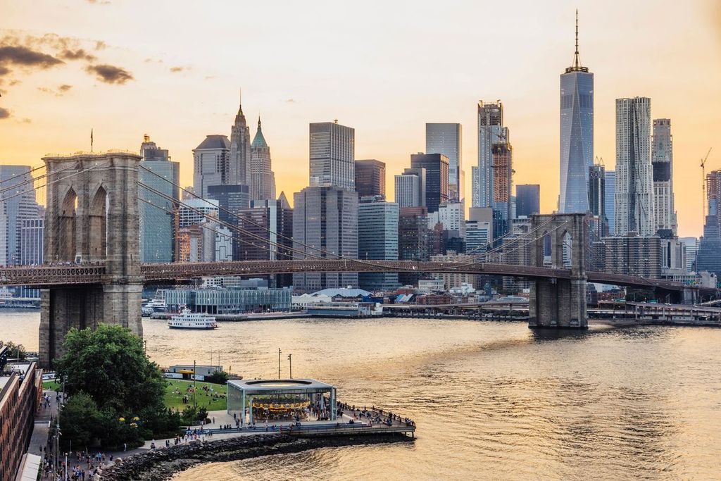 New York skyline at sunset with the Brooklyn Bridge in focus