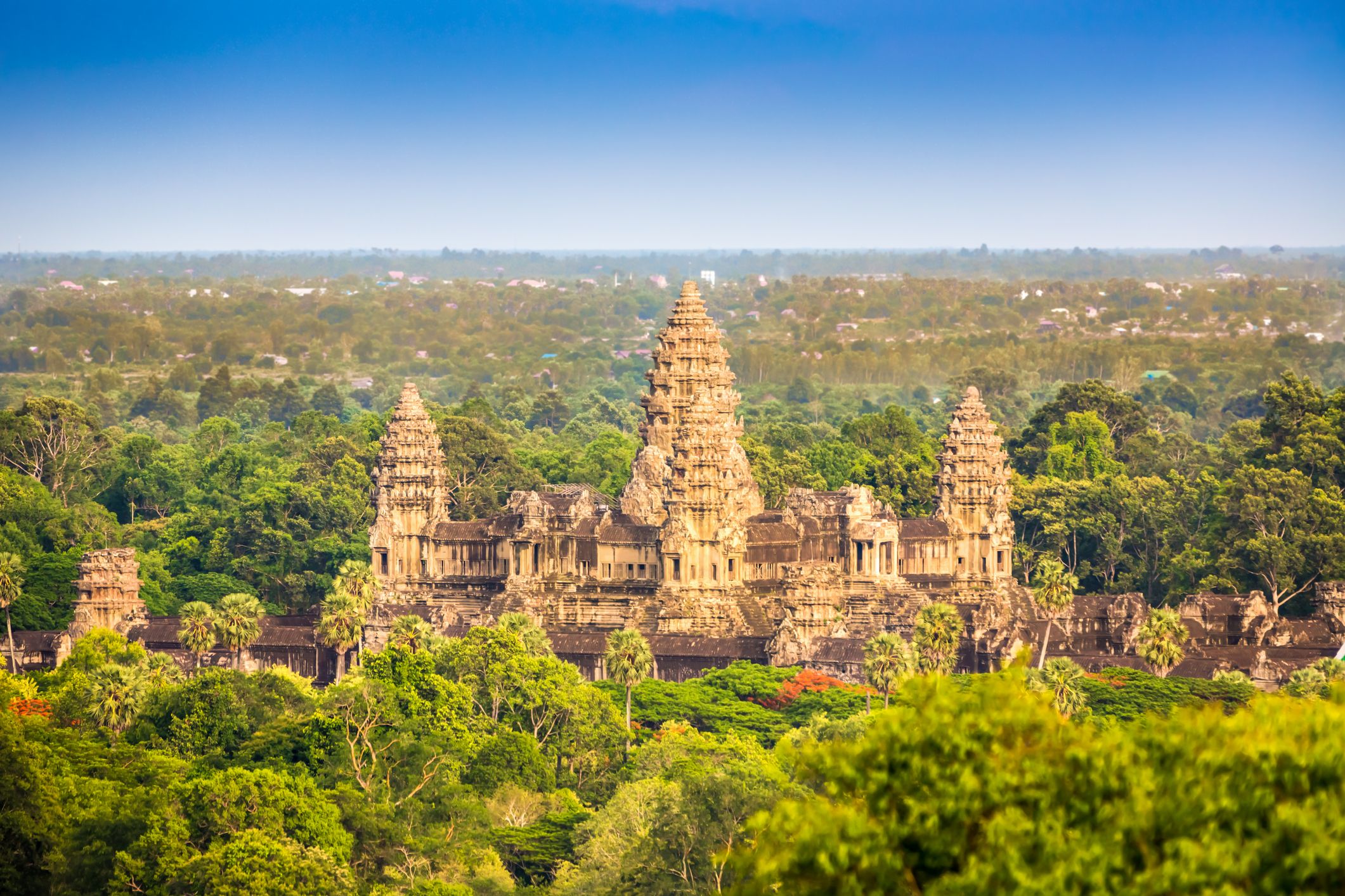 View over the tropical forest towards the Angkor Thom Temple Complex, Siem Reap, Cambodia