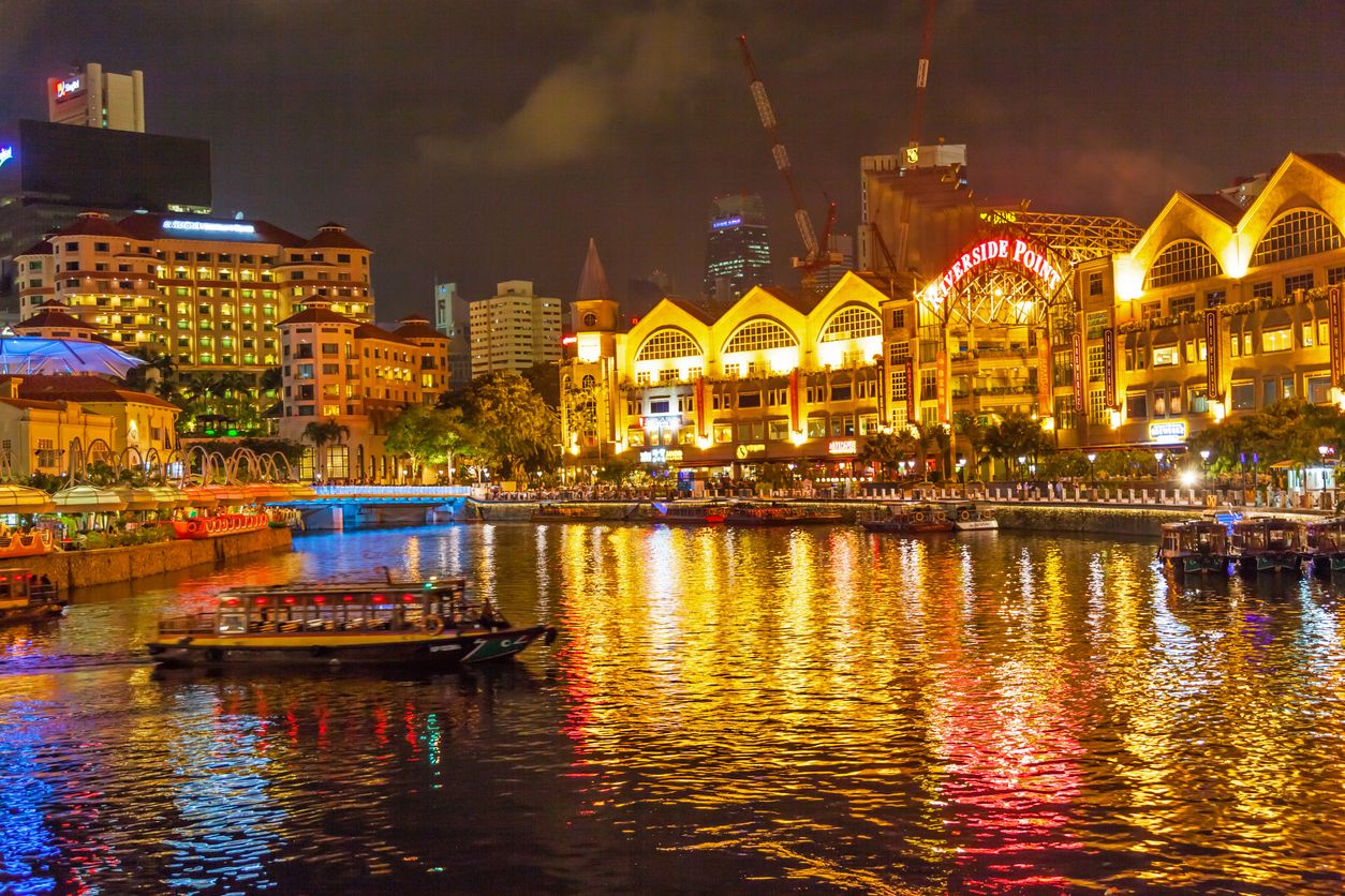 A traditional bumboat on the Singapore River at night