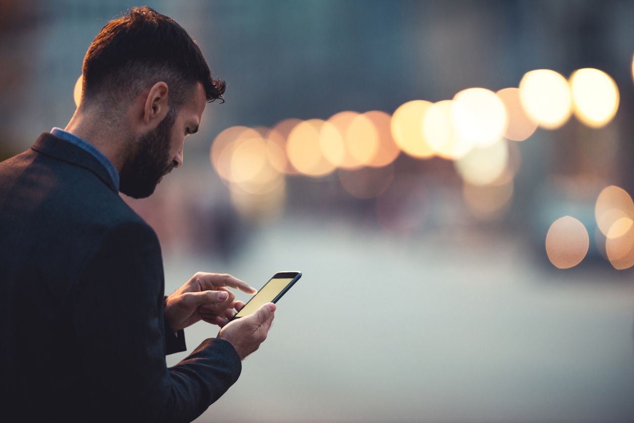 young businessman texting on the cellphone
